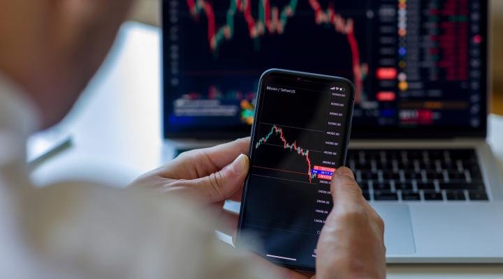 crypto-investing-market-down-concept-smartphone-laptop_iStock-1410140346